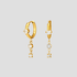 GRISÉ NYC dangle gemstone hoop earrings in 18k yellow gold with cubic zirconia drop stones.