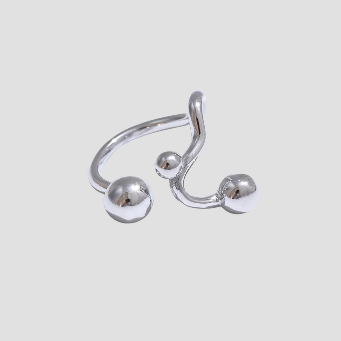 GRISÉ NYC Dots Stainless Steel Adjustable Ring featuring a polished silver open band with modern sphere accents and an adjustable minimalist design.