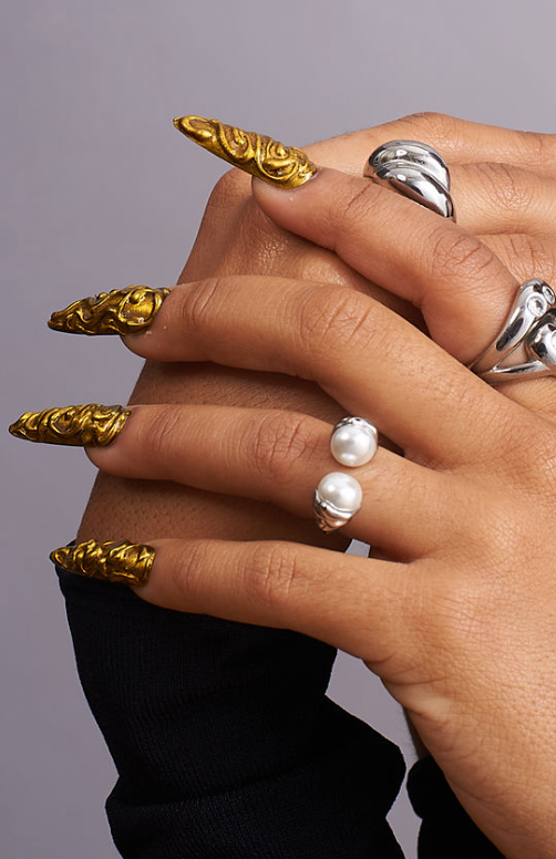 Model wearing GRISÉ NYC double pearl stainless steel open ring.