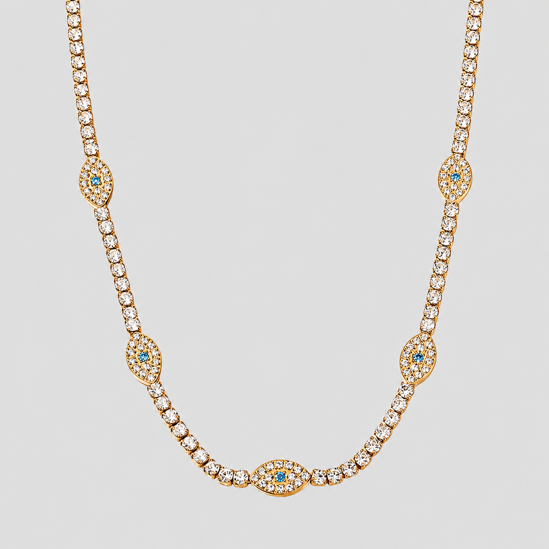 GRISÉ NYC Evil Eye Tennis Necklace in 18k gold plated stainless steel with sparkling evil eye accents.