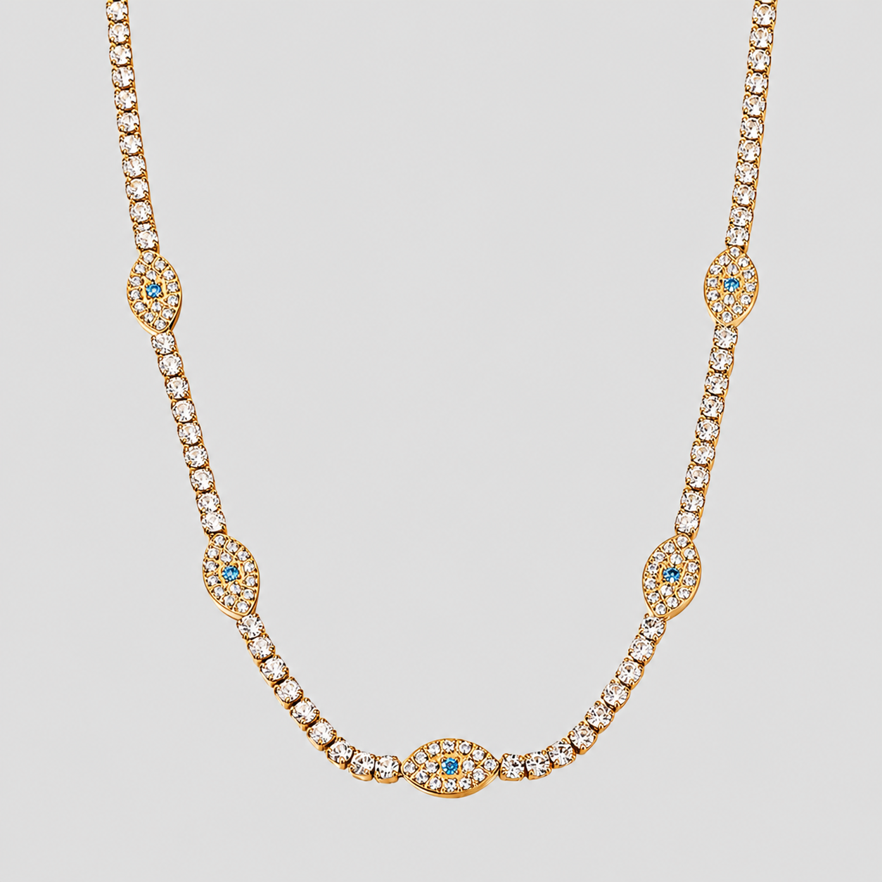 GRISÉ NYC Evil Eye Tennis Necklace in 18k gold plated stainless steel with sparkling evil eye accents.