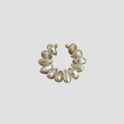 Freshwater pearl single ear cuff with gold tone setting by GRISÉ NYC.
