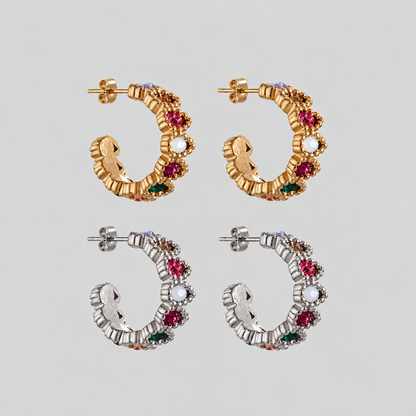 GRISÉ NYC Gemma Multicolor Hoop Earrings in gold and silver, featuring textured sculptural hoops adorned with vibrant multicolored cubic zirconia stones and butterfly back closures.