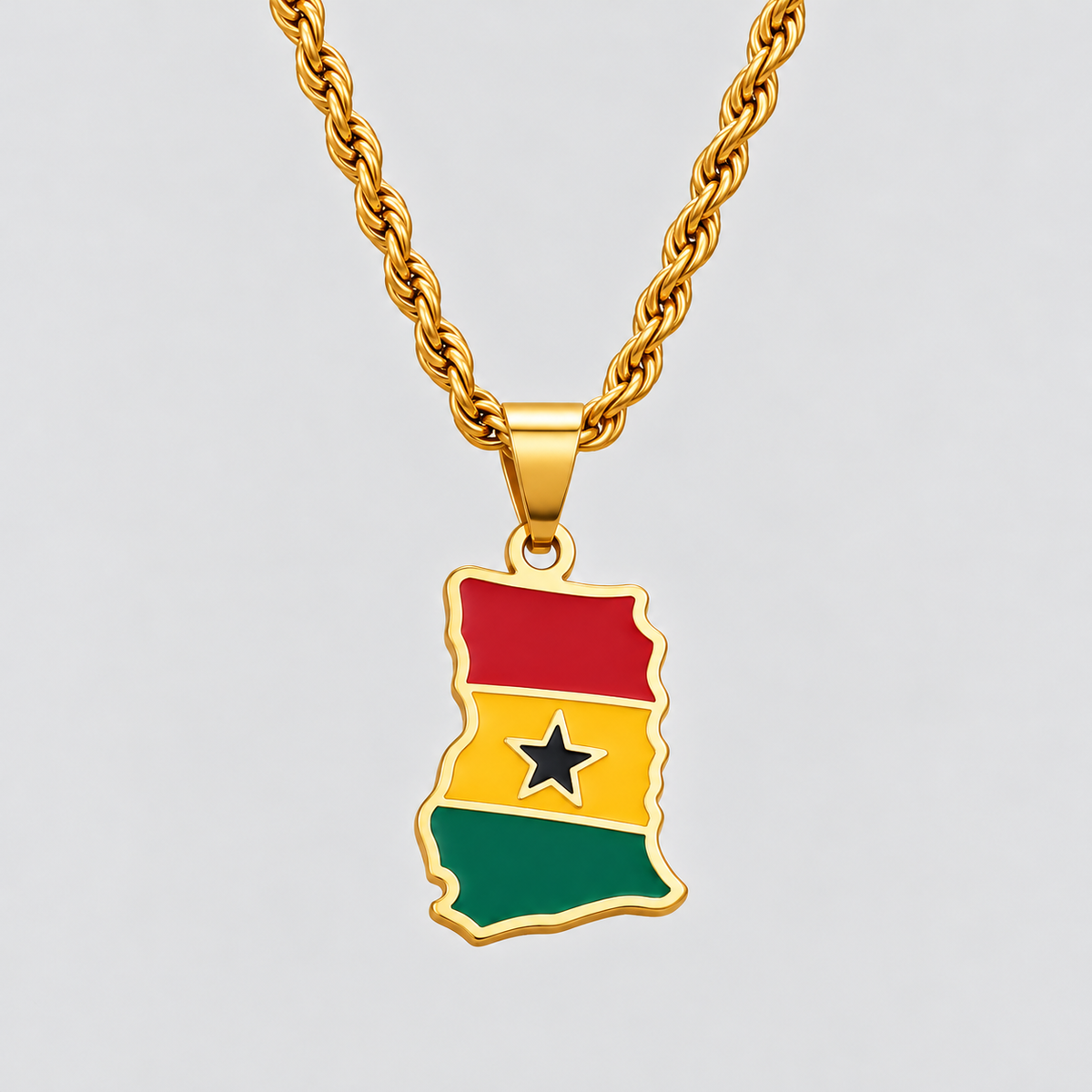 GRISÉ NYC gold Ghana flag map pendant necklace featuring red, yellow, and green enamel detailing with a black star, paired with a 3mm gold rope chain.