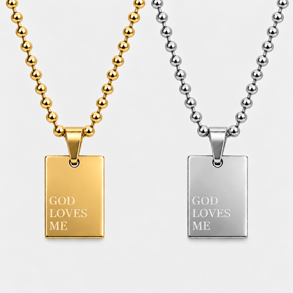 GOD LOVES ME pendant necklace by GRISÉ NYC shown in gold and silver colorways.