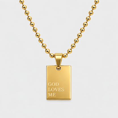GOD LOVES ME engraved pendant necklace in 18K gold-plated stainless steel by GRISÉ NYC.