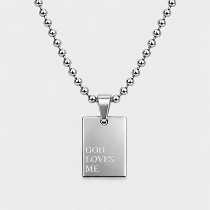 GOD LOVES ME engraved pendant necklace in silver stainless steel by GRISÉ NYC.