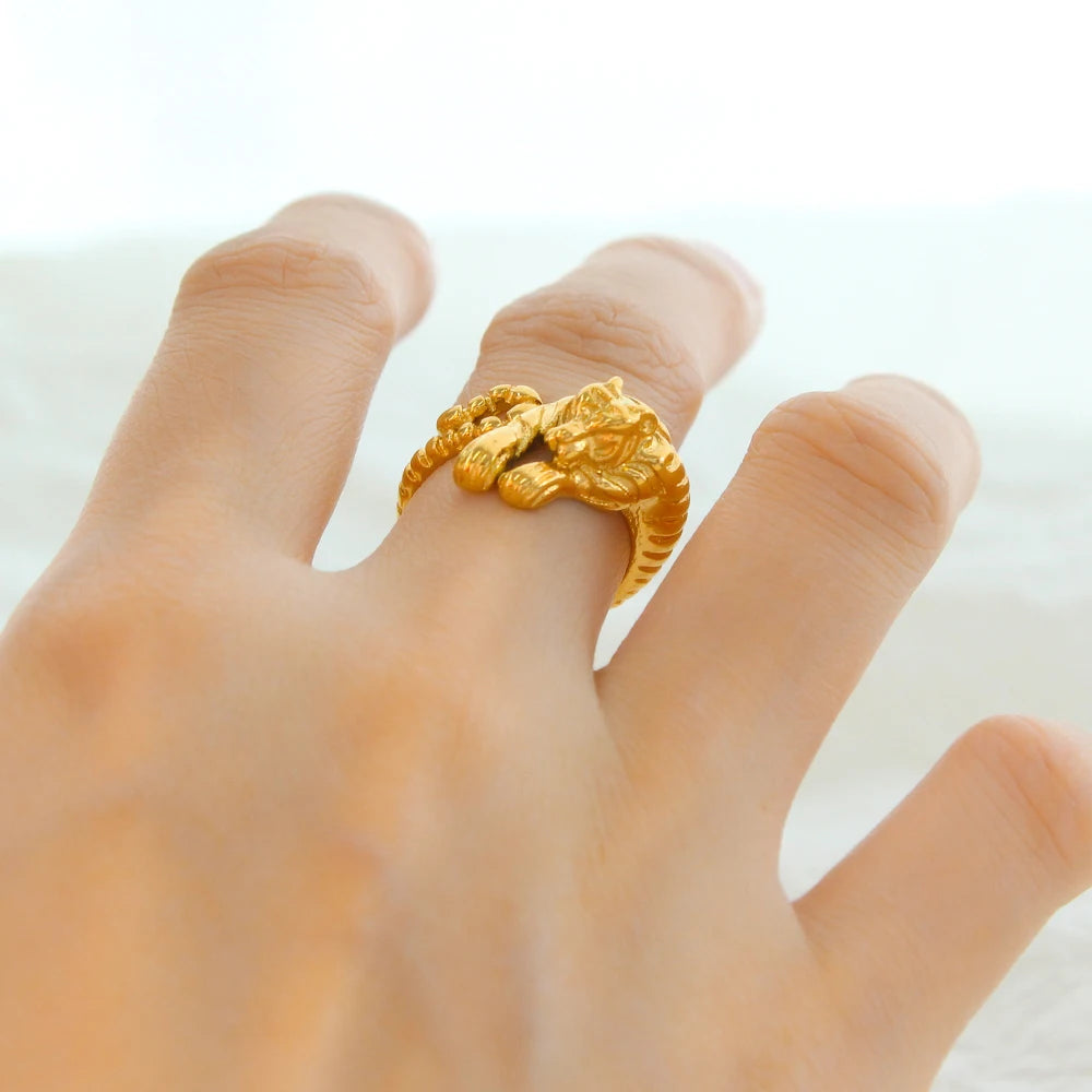Golden Tiger statement ring by GRISÉ NYC worn on model hand in 18k gold plated stainless steel unisex adjustable ring.