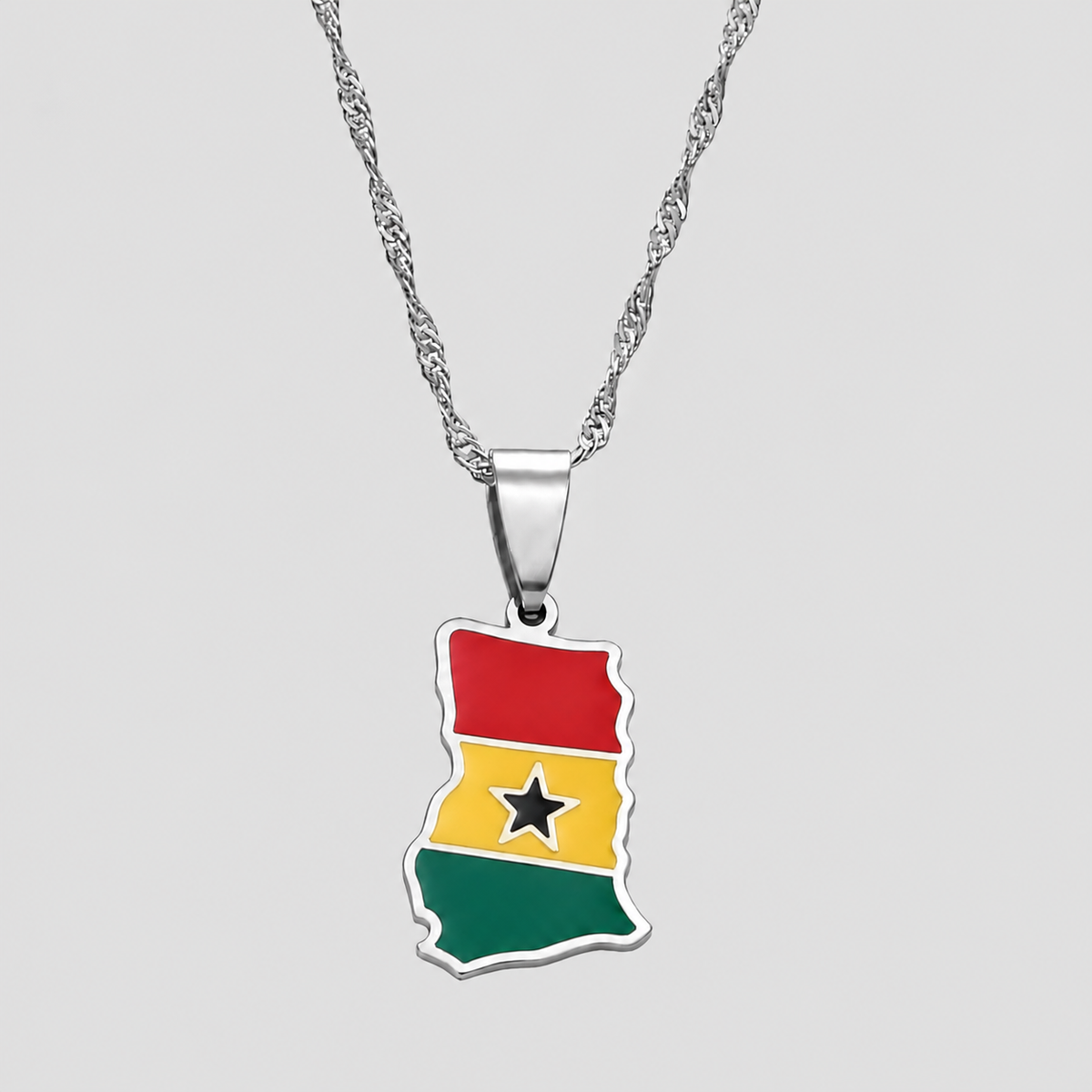 Silver-tone Guyana flag map pendant necklace by GRISÉ NYC featuring a textured silver chain and colorful enamel detailing inspired by Guyanese heritage.
