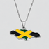 Silver Jamaica flag map pendant necklace by GRISÉ NYC featuring black, green, and gold enamel detailing on a polished silver-tone island silhouette with a textured silver chain.