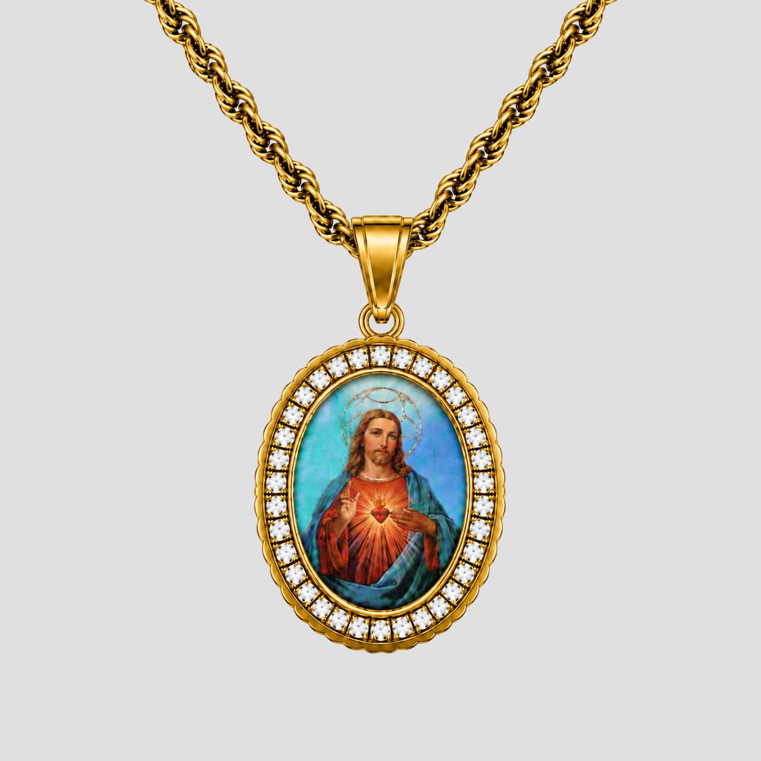 GRISÉ NYC Jesus Christ Oval Gemstone Pendant Necklace featuring white gemstones and a gold-tone stainless steel rope chain.