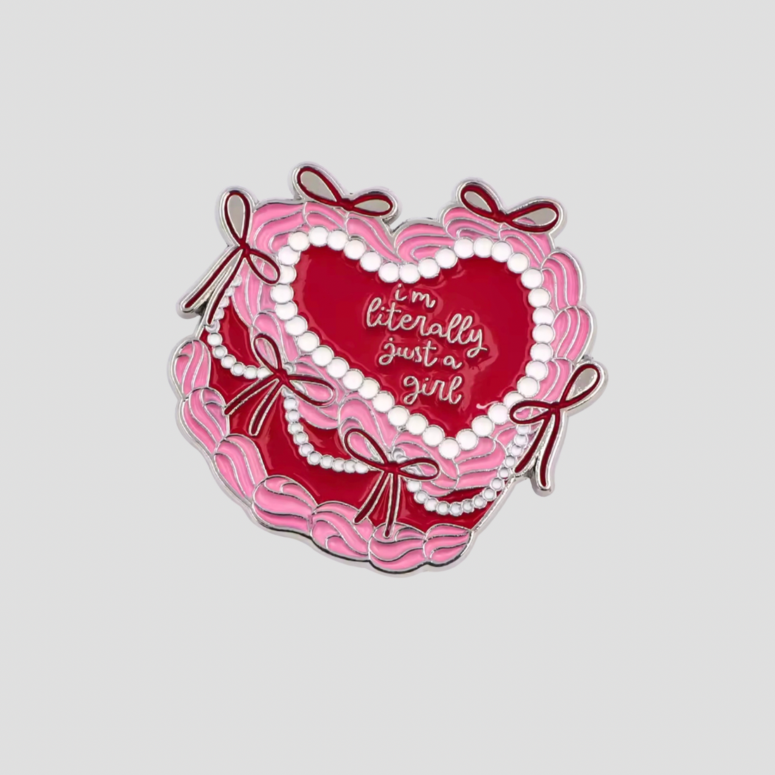 GRISÉ NYC Just a Girl heart enamel pin with pearl detailing and silver tone finish.