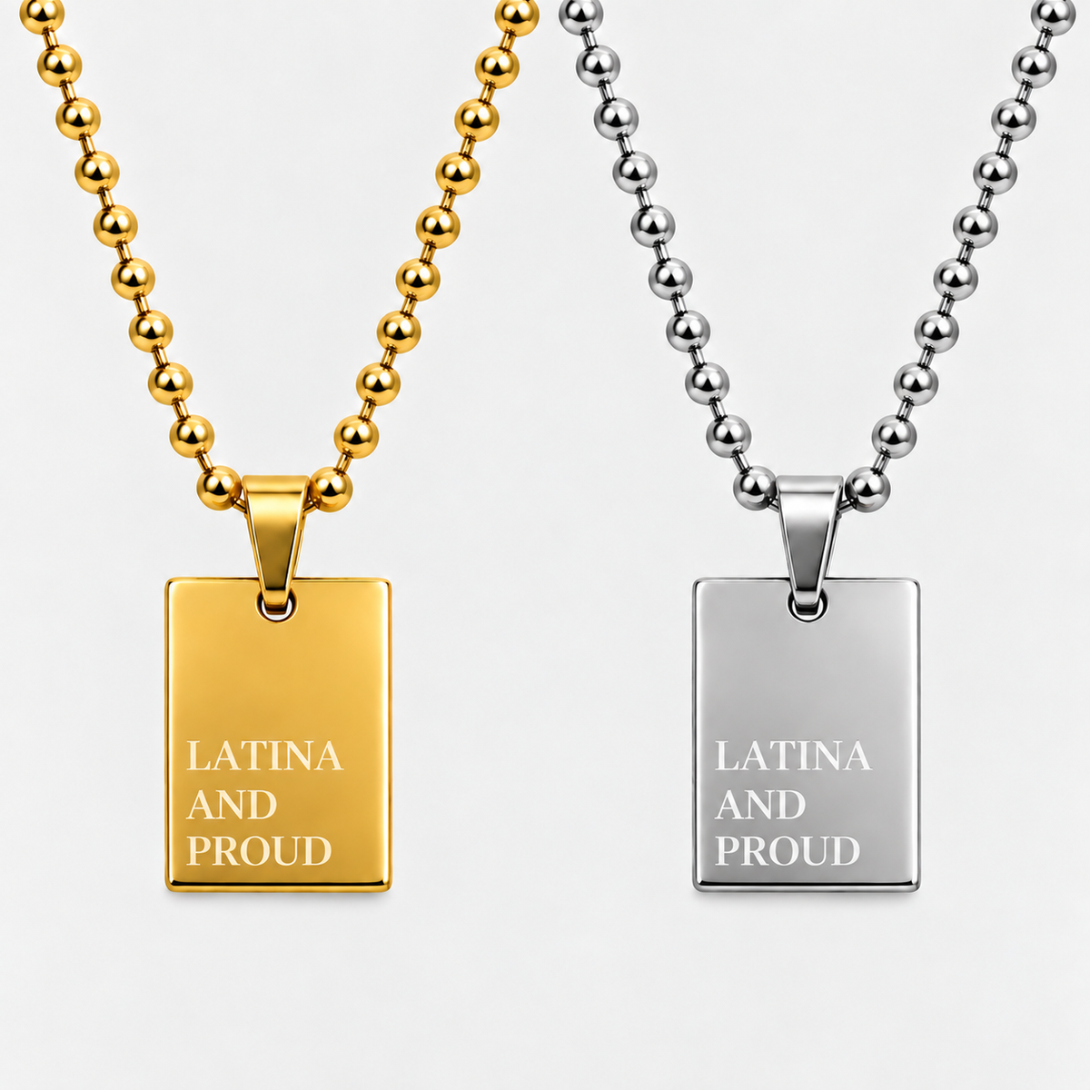 GRISÉ NYC LATINA AND PROUD pendant necklace in gold and silver.