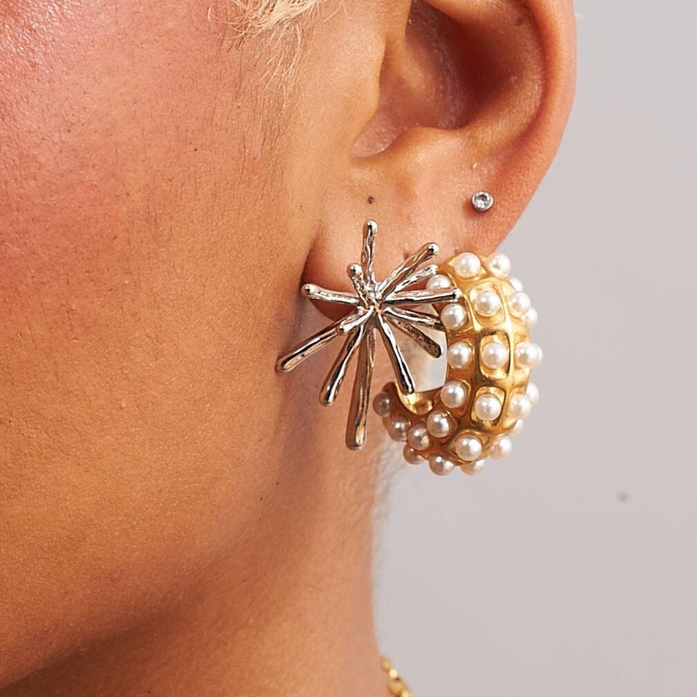 Model wearing Mimi bold pearl hoop earrings in 18k gold plated stainless steel by GRISÉ NYC.