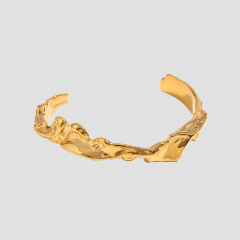 Molten flow 18k gold cuff bracelet by GRISÉ NYC with sculptural molten texture.
