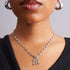 New York Yankees stainless steel mariner necklace by GRISÉ NYC worn on female model, silver NY pendant chain close-up.