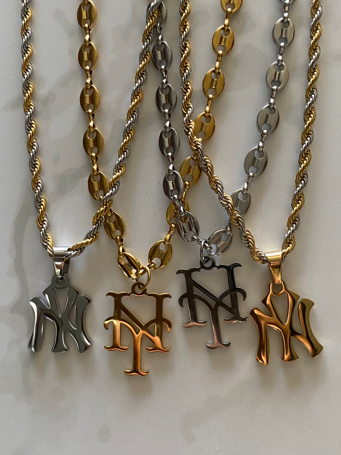 GRISÉ NYC NY Yankees rope chain necklaces in gold and two tone stainless steel.