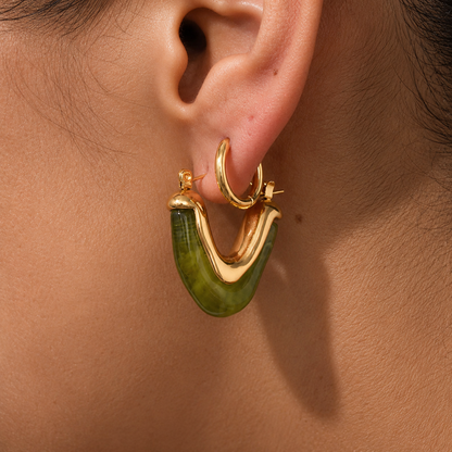Model wearing GRISÉ NYC olive resin gold plated hoop earring