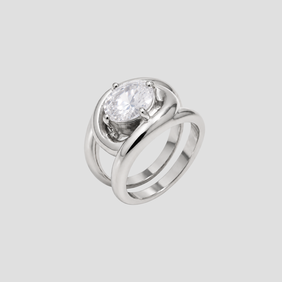 GRISÉ NYC silver statement ring with oversized oval cubic zirconia stone on light grey background