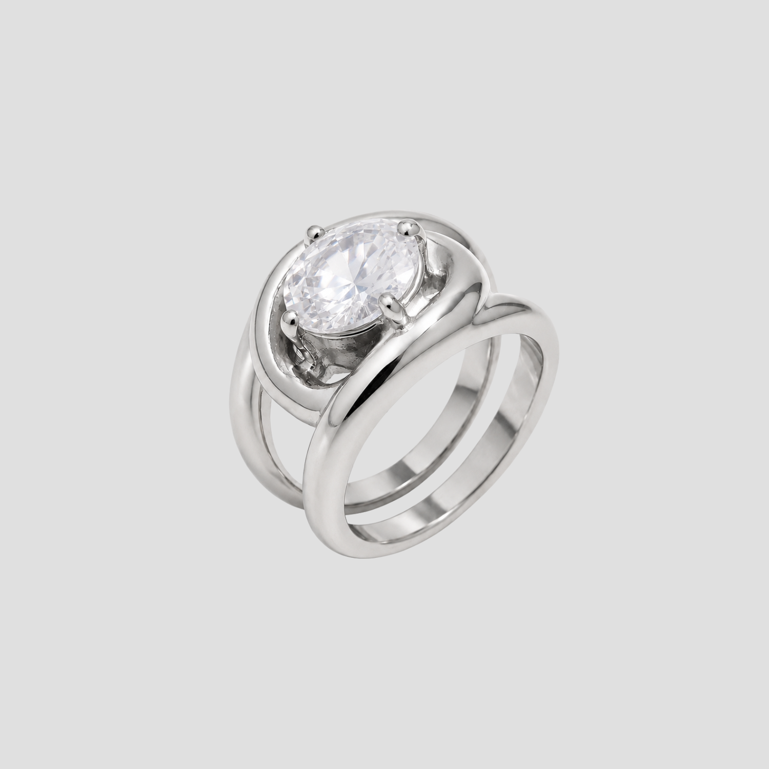 GRISÉ NYC silver statement ring with oversized oval cubic zirconia stone on light grey background