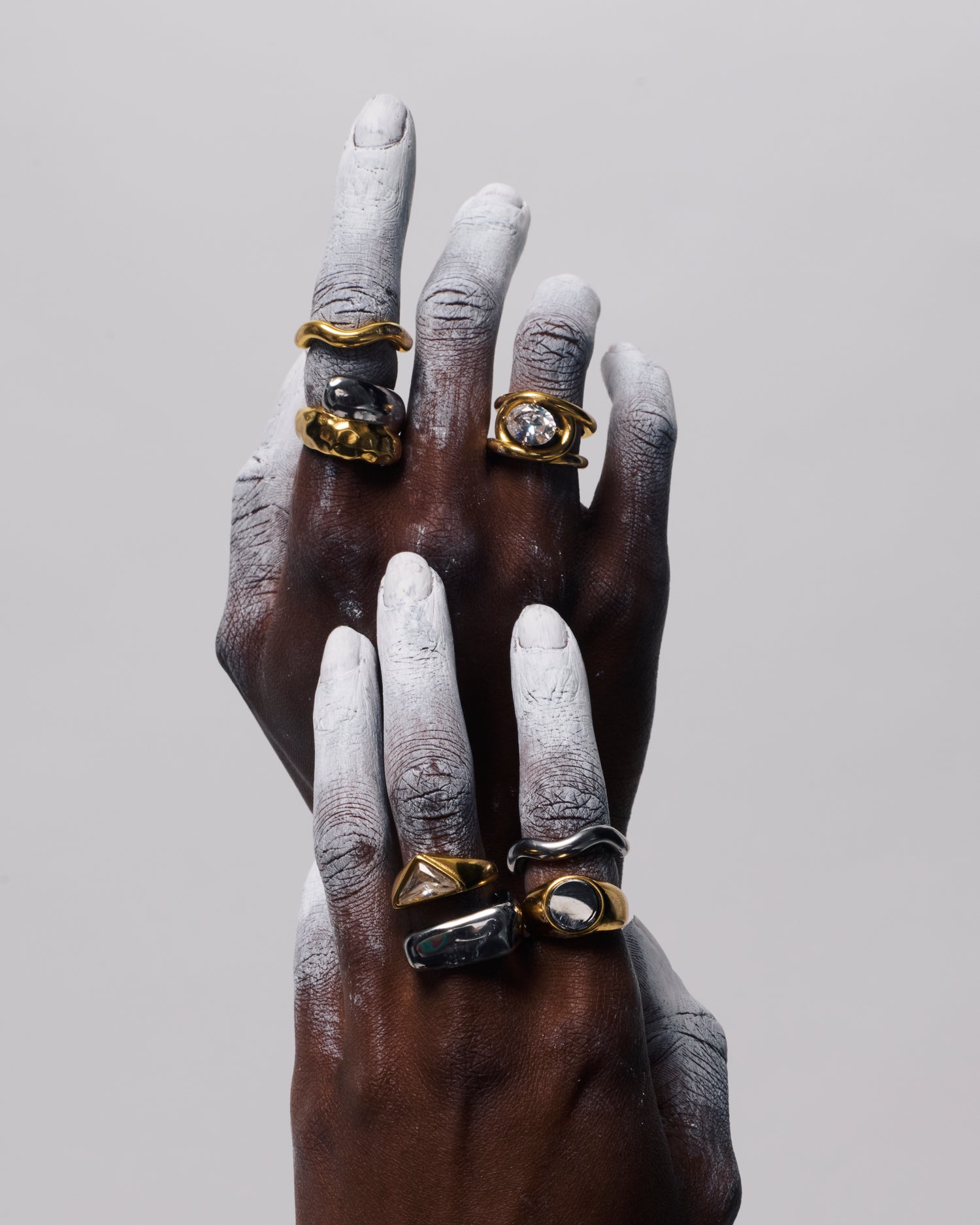 Close up of GRISÉ NYC oval gemstone gold ring with bold sculptural design and radiant crystal stone
