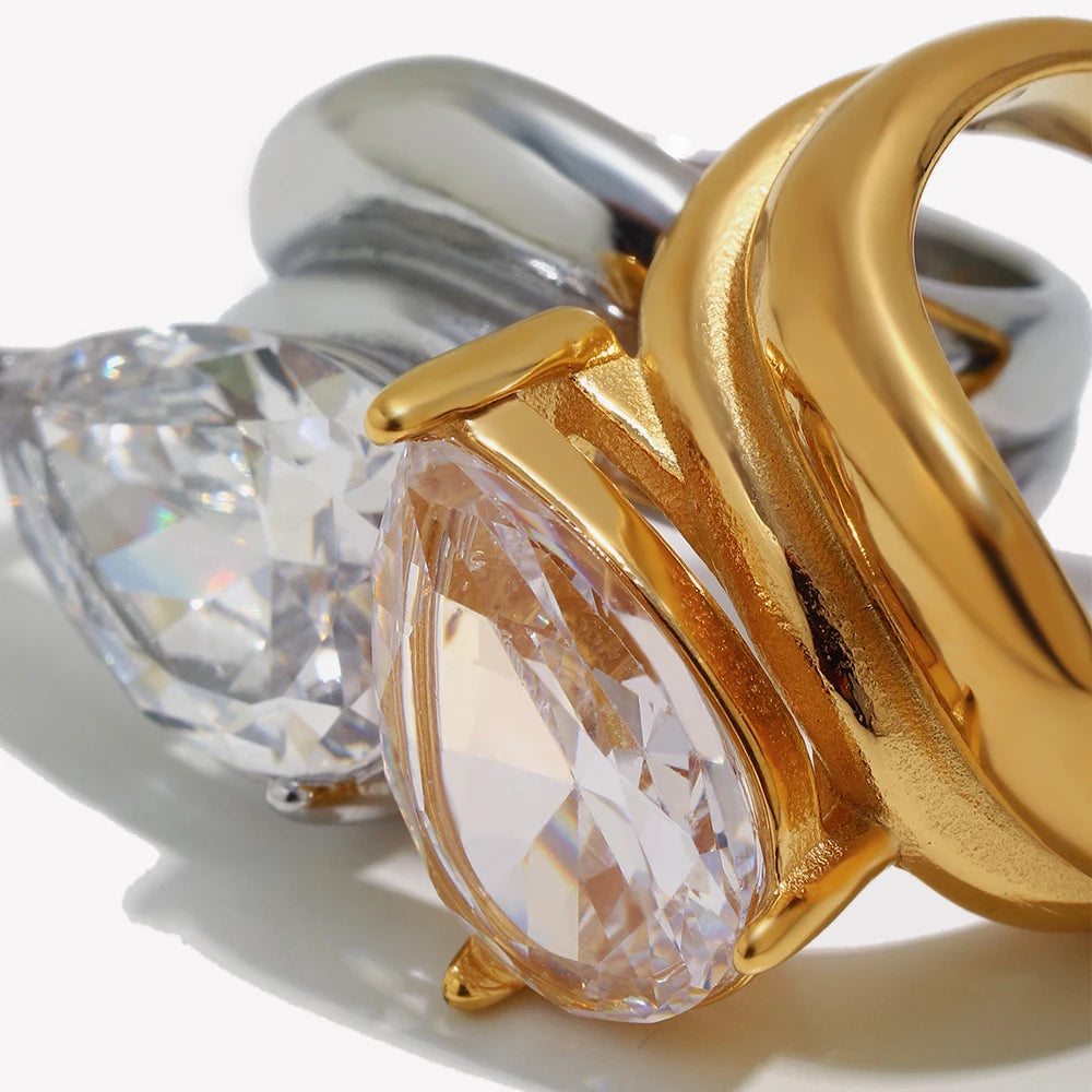 Close up of GRISÉ NYC Pear Cut Gemstone Ring showcasing sculptural molten gold band and pear cut gemstone