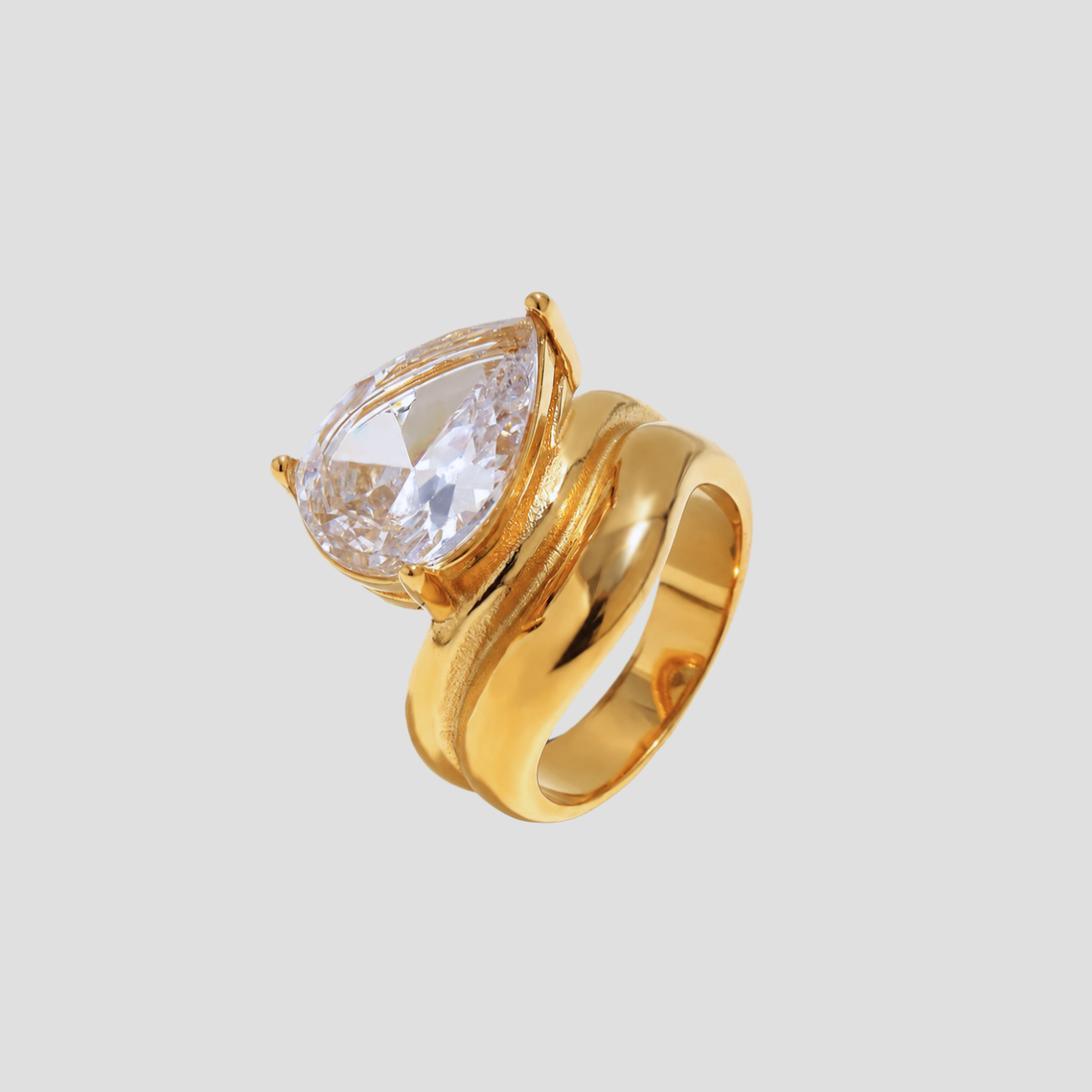 GRISÉ NYC Pear Cut Gemstone Ring in 18k gold plated stainless steel with oversized pear cut gemstone on light gray background