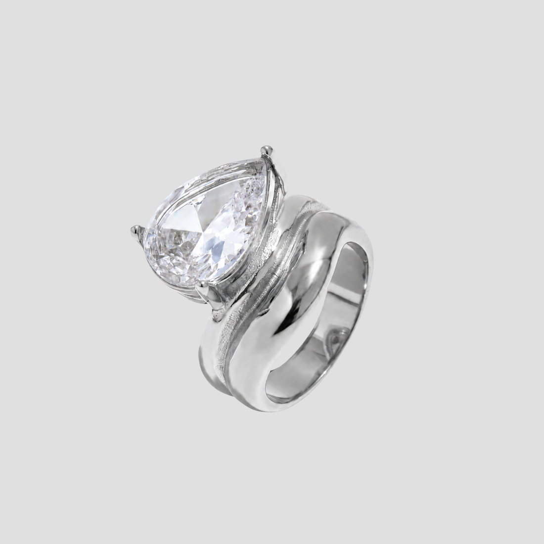 GRISÉ NYC Pear Cut Gemstone Ring in polished silver stainless steel with oversized pear cut gemstone on light gray background