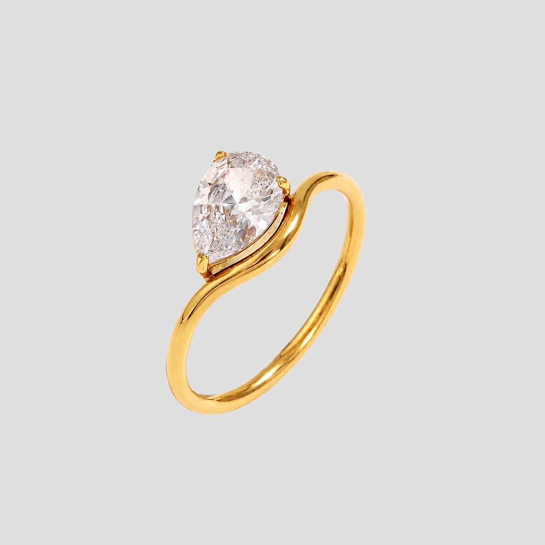 GRISÉ NYC Single Pear Cut Gemstone Band Ring in 18k gold plated stainless steel on light gray background