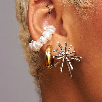Freshwater pearl ear cuff styled in ear stack with modern jewelry by GRISÉ NYC.
