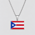 Silver Puerto Rico flag pendant necklace by GRISÉ NYC featuring red, white and blue enamel detailing, polished silver-tone frame and silver cable chain on a light gray background.