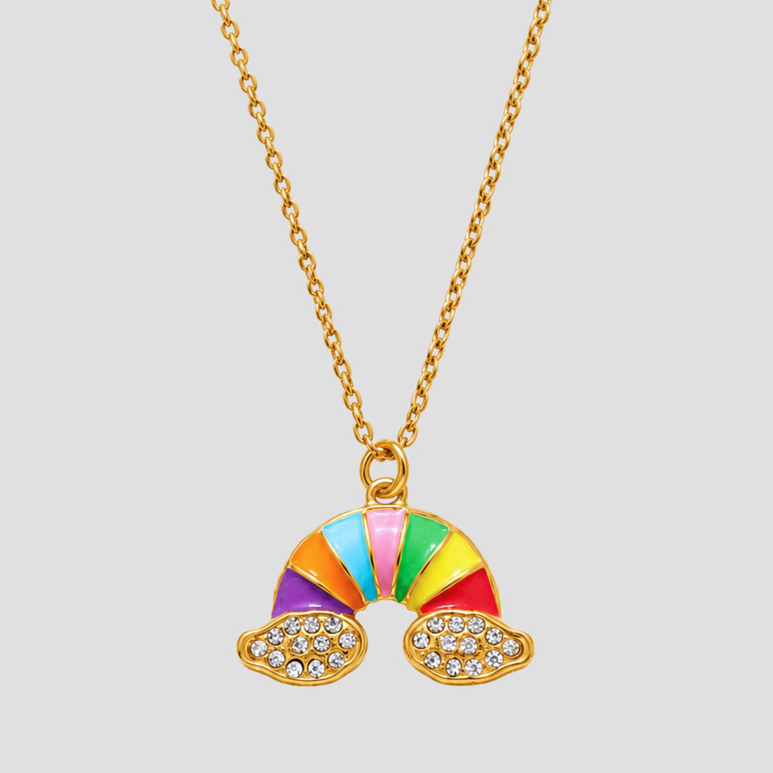 GRISÉ NYC Rainbow Cloud Pendant Necklace in 18K gold plated stainless steel with colorful enamel rainbow, pavé CZ cloud details, and waterproof tarnish-resistant finish.
