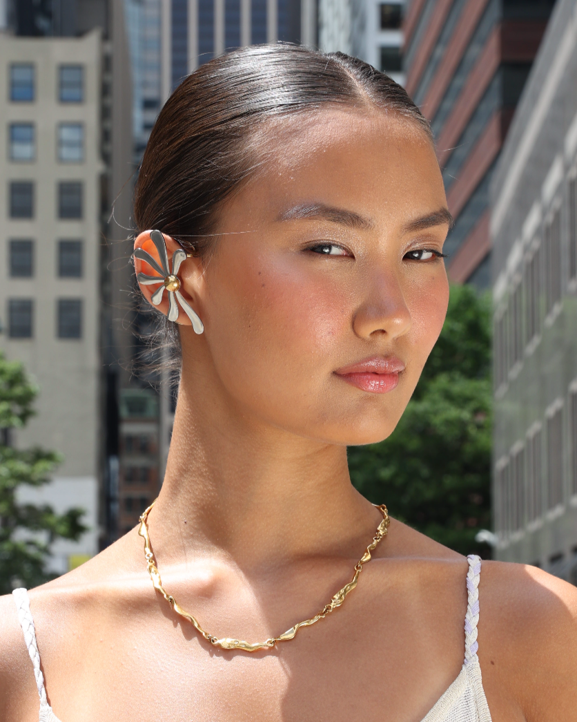 Model wearing GRISÉ NYC rugged gold necklace in street style look