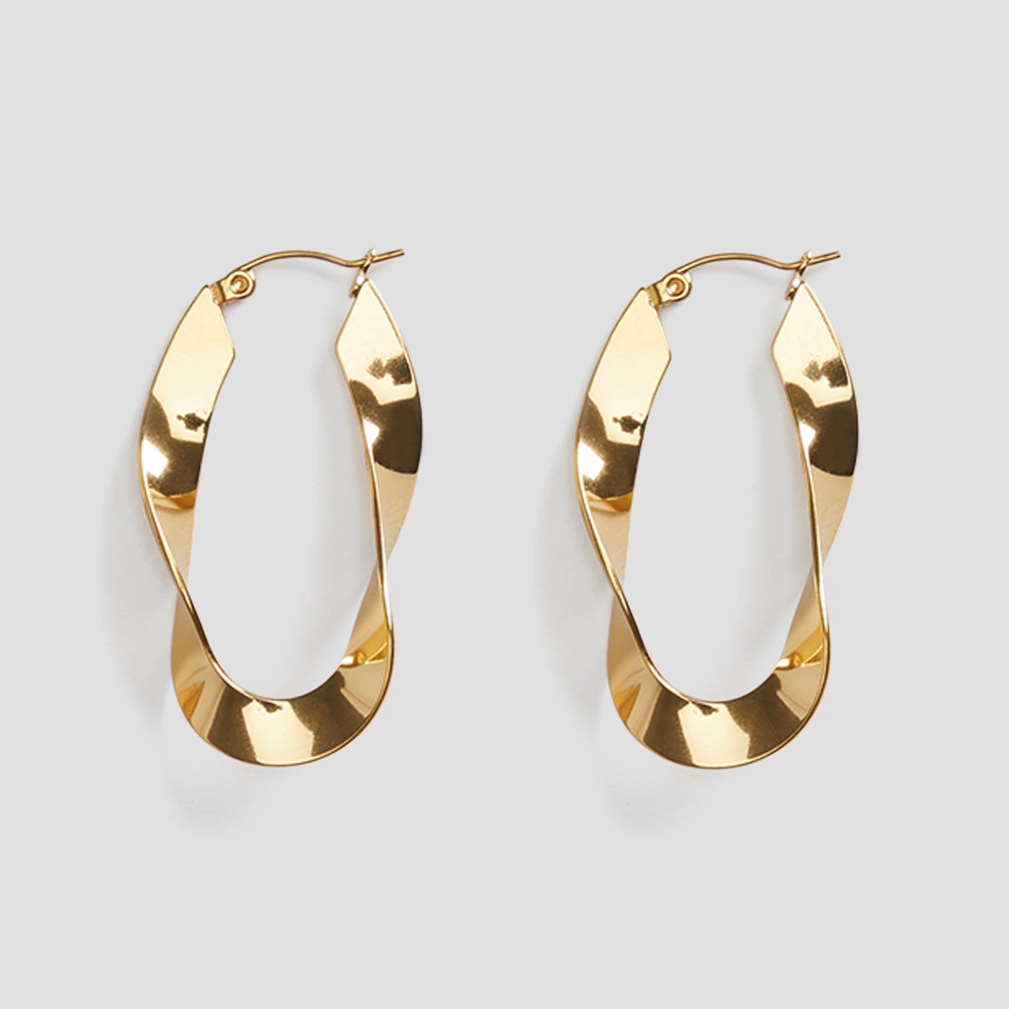 GRISÉ NYC twisted gold hoop earrings close up high shine finish