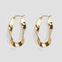 GRISÉ NYC twisted gold hoop earrings close up high shine finish