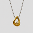 Flat lay of GRISÉ NYC two-tone pearl gold plated necklace.