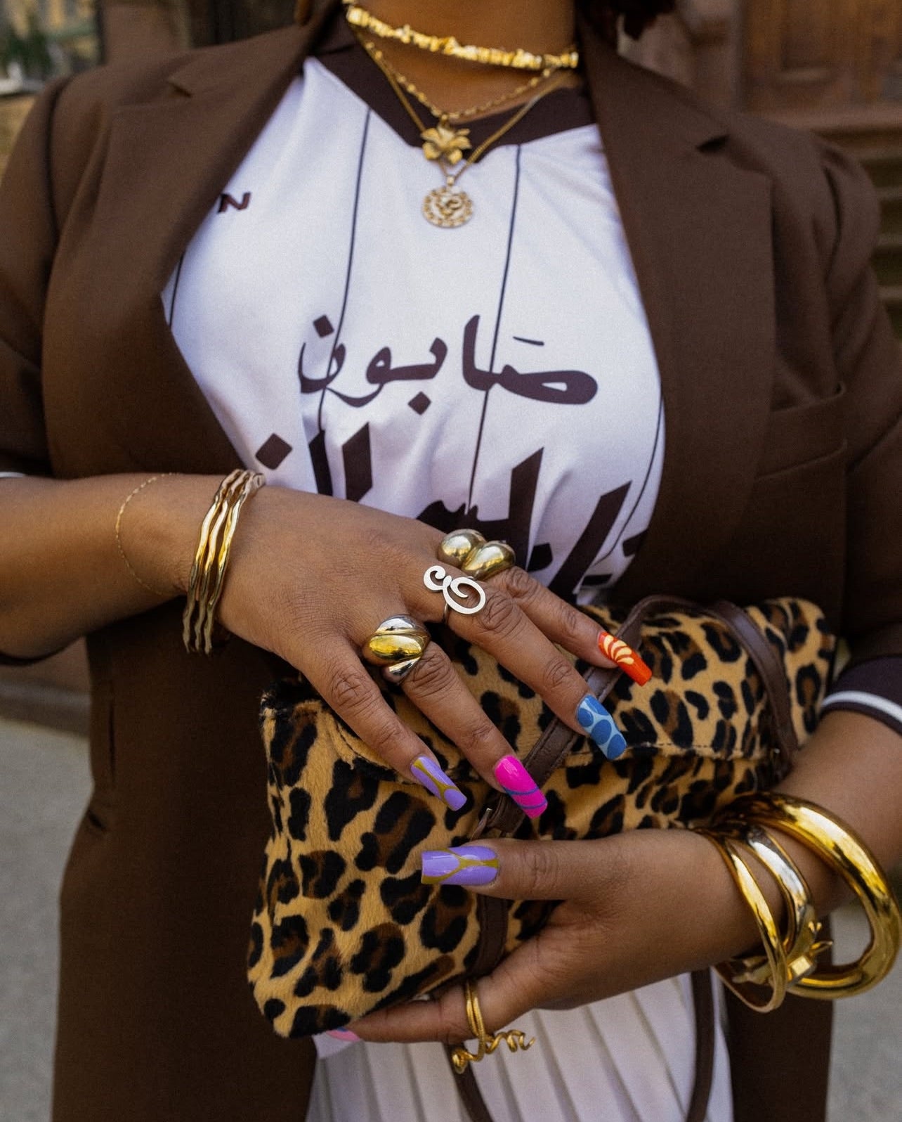 GRISÉ NYC two tone XL bubble ring styled with mixed metal jewelry.