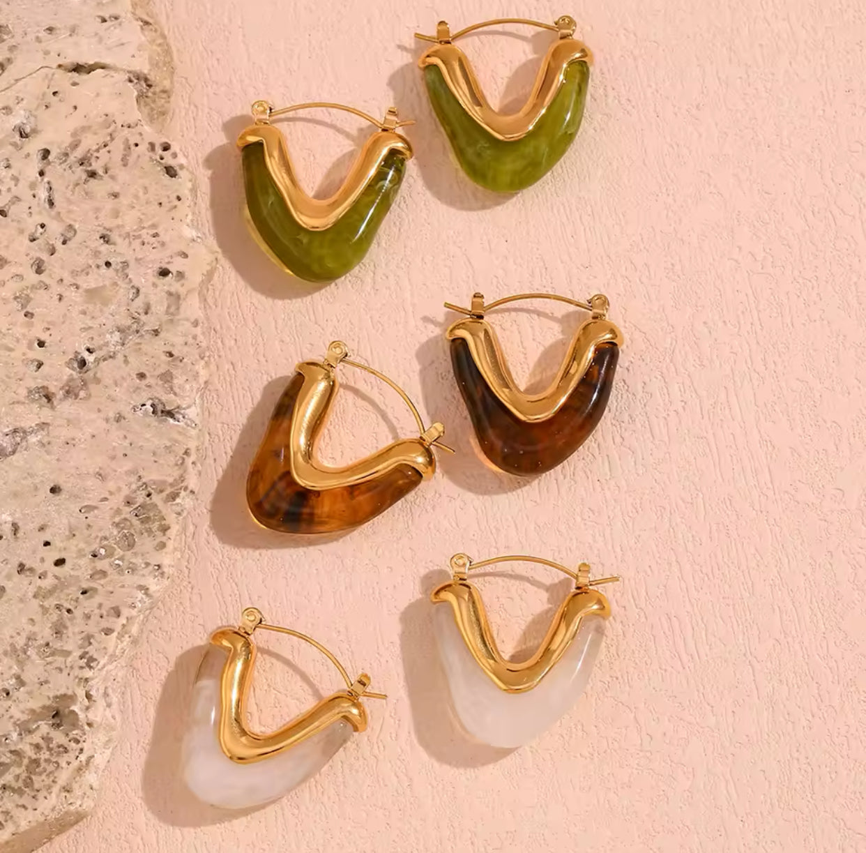 Modern V shape gold earrings with resin finish in different colorways -- olive, clear, and tortoise 