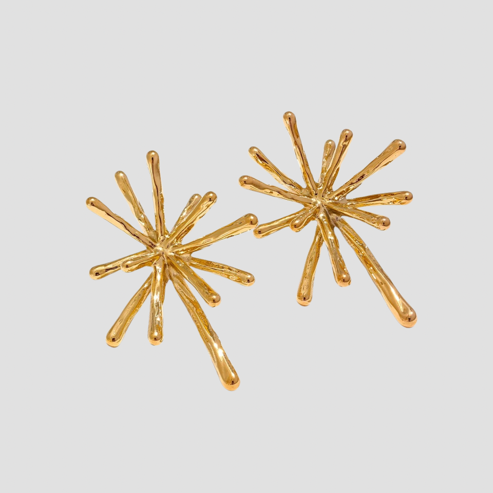 GRISÉ NYC gold snowflake stud earrings in 18k gold plated stainless steel with abstract sunburst design, unisex statement jewelry