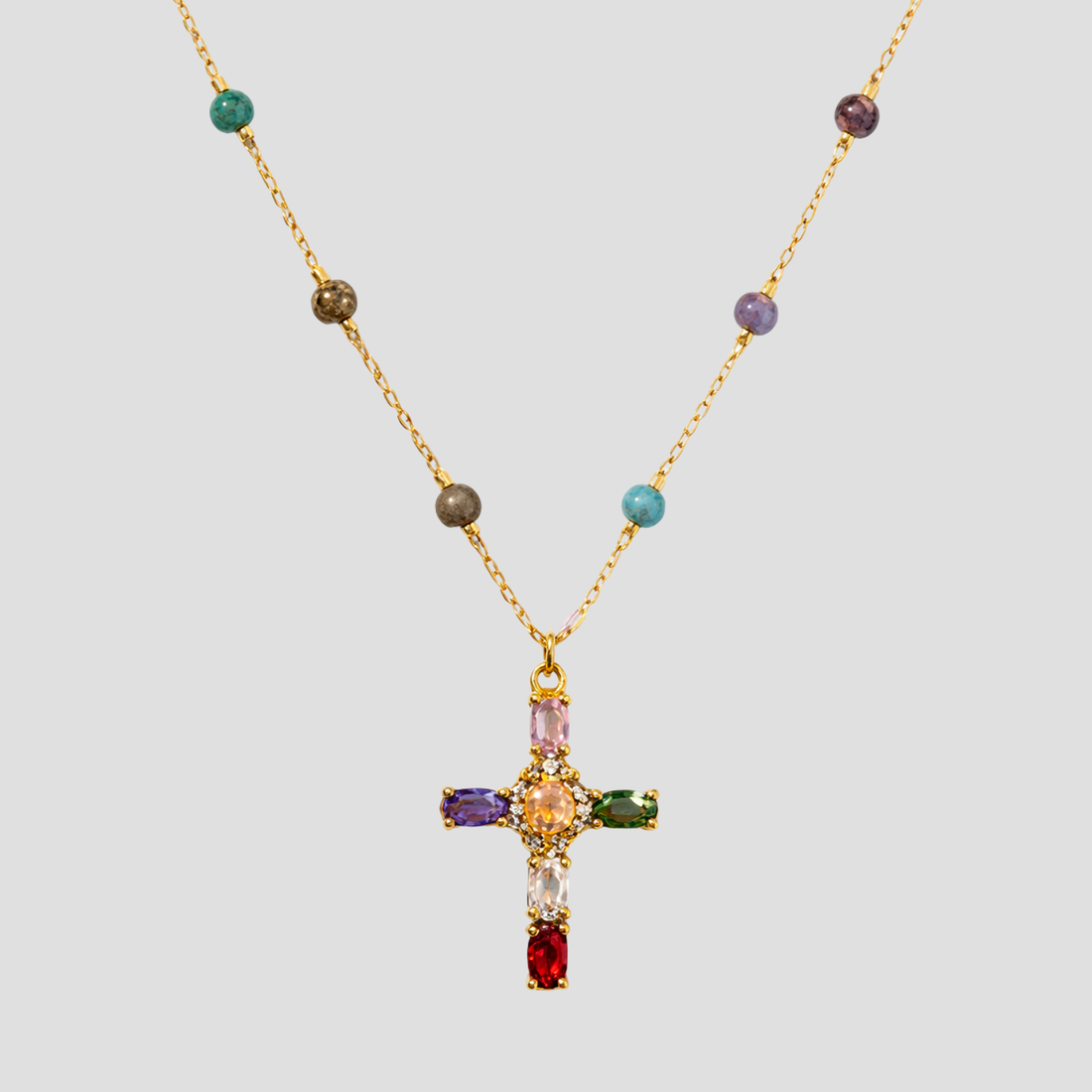 Multicolor gemstone cross pendant beaded gold necklace by GRISÉ NYC featuring colorful stones and delicate gold chain.