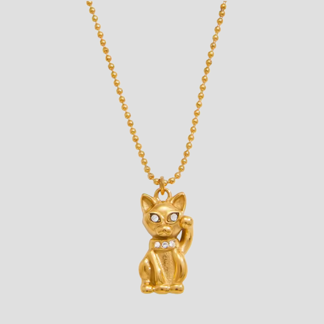 18k gold plated lucky fortune cat necklace with rhinestone detailing on a gold ball chain against a light grey background