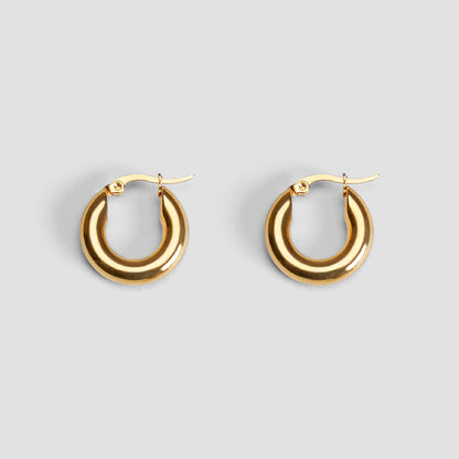 Pair of 20 mm mini hoop earrings in 18K gold-plated stainless steel by GRISÉ NYC.