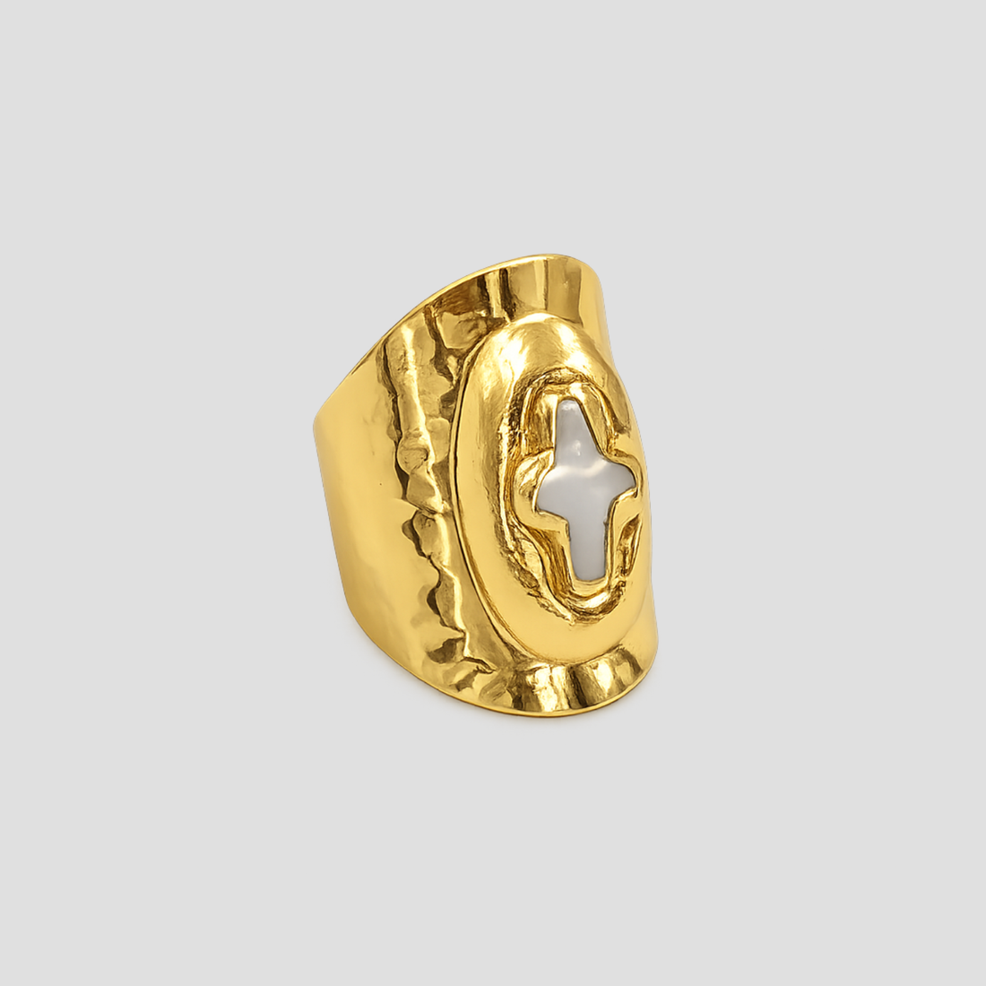 Mother of Perlita Cross gold signet ring with mother of pearl cross detail by GRISÉ NYC on light gray background.