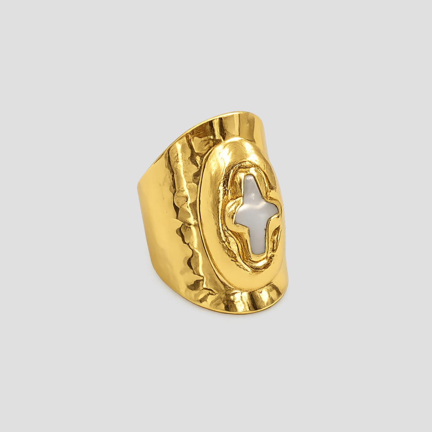 Mother of Perlita Cross gold signet ring with mother of pearl cross detail by GRISÉ NYC on light gray background.