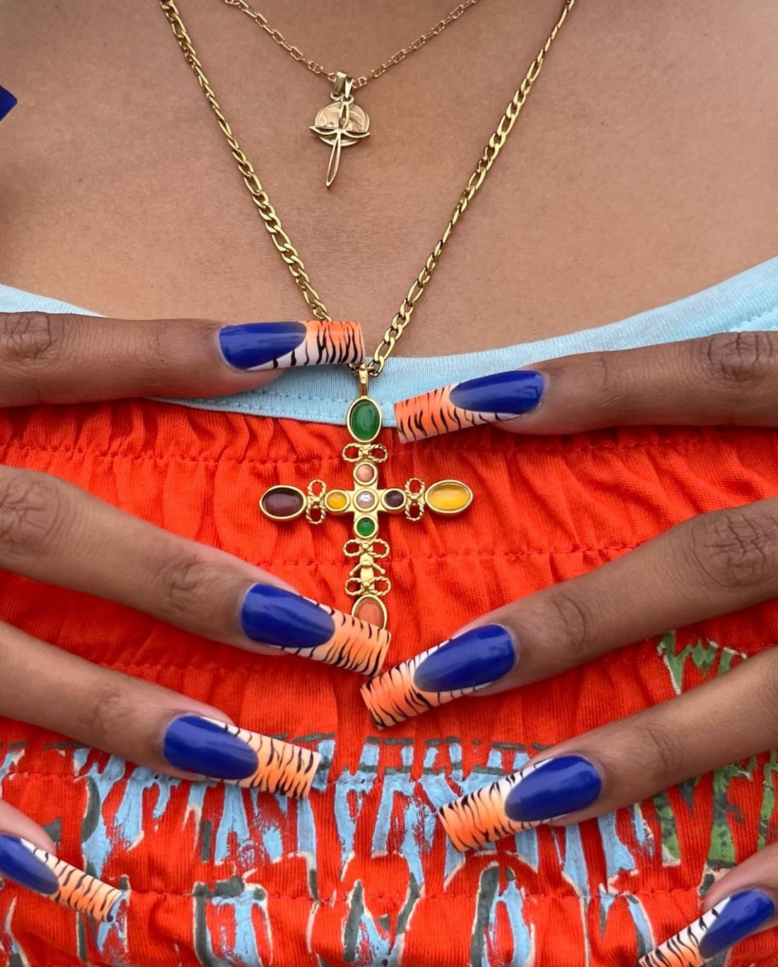 Multi Stone Cross Pendant Necklace worn layered with gold jewelry