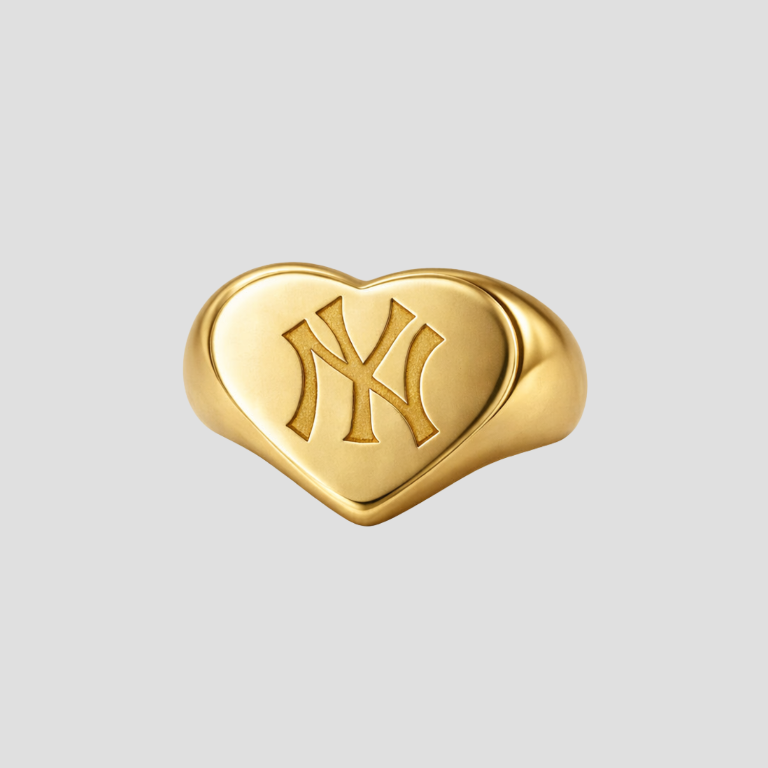 Puffed heart shaped New York Yankees signet ring in silver by GRISÉ NYC with rounded edges and engraved NY logo.
