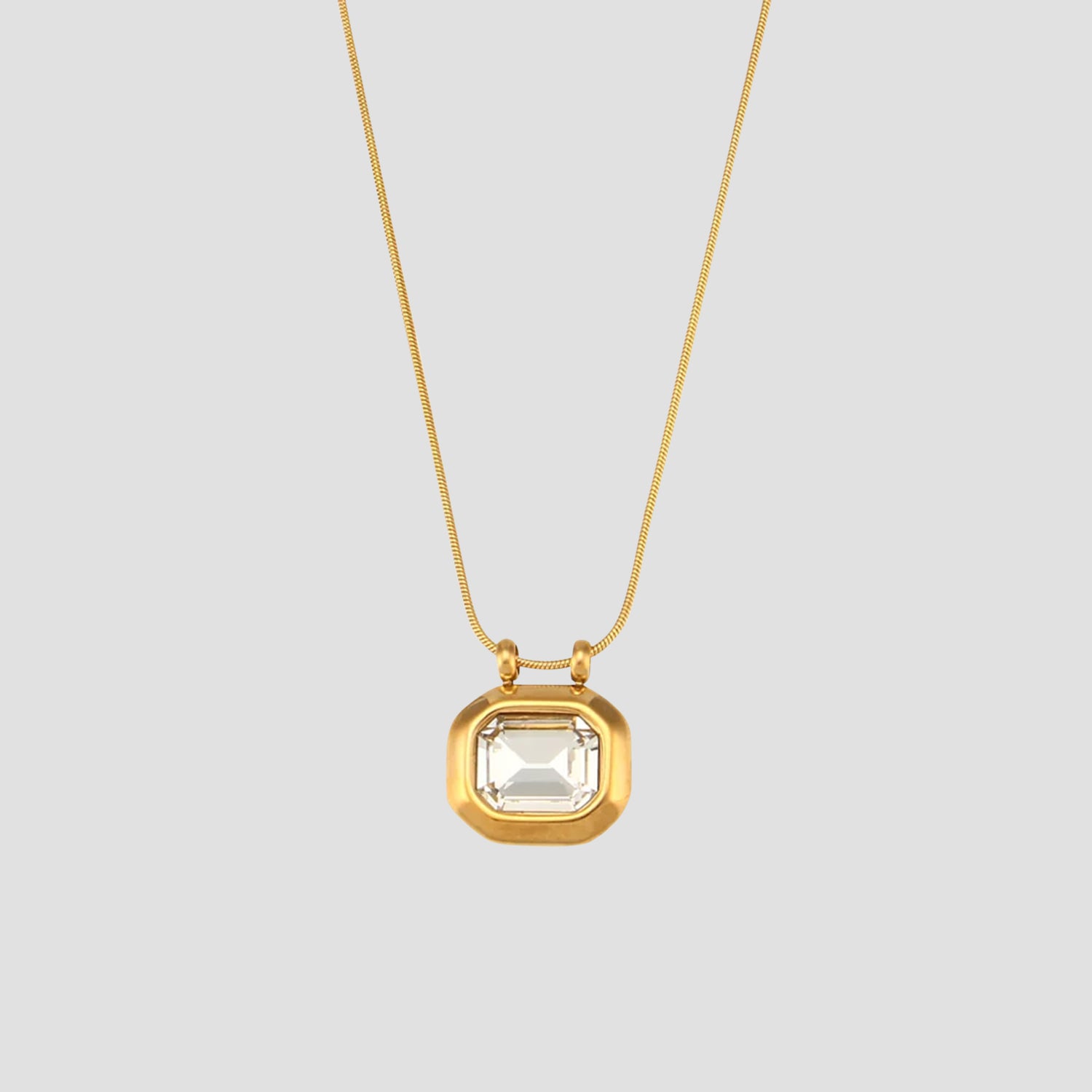 Octo Gemstone Pendant Necklace in 18k gold plated stainless steel with clear crystal gemstone pendant.