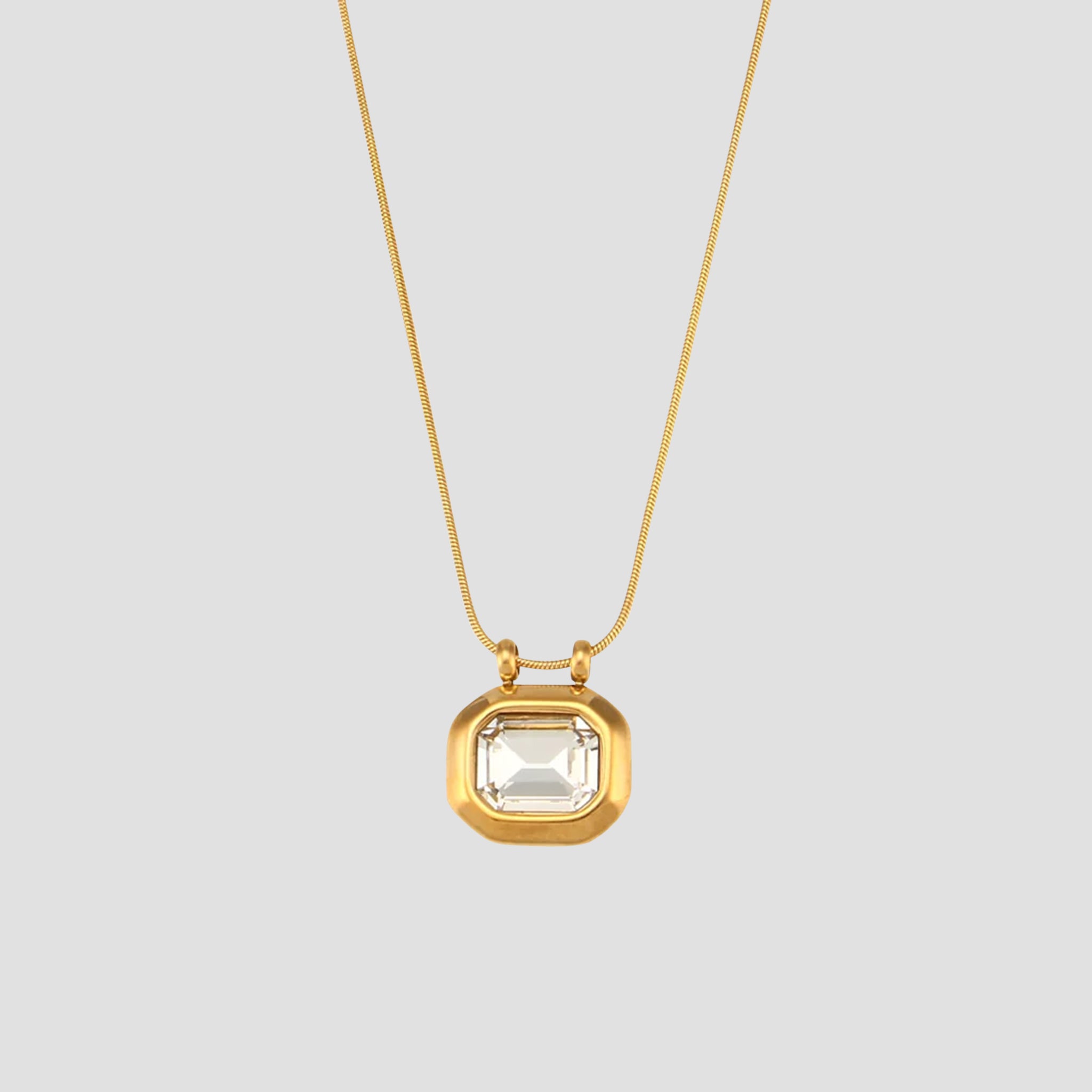 Octo Gemstone Pendant Necklace in 18k gold plated stainless steel with clear crystal gemstone pendant.