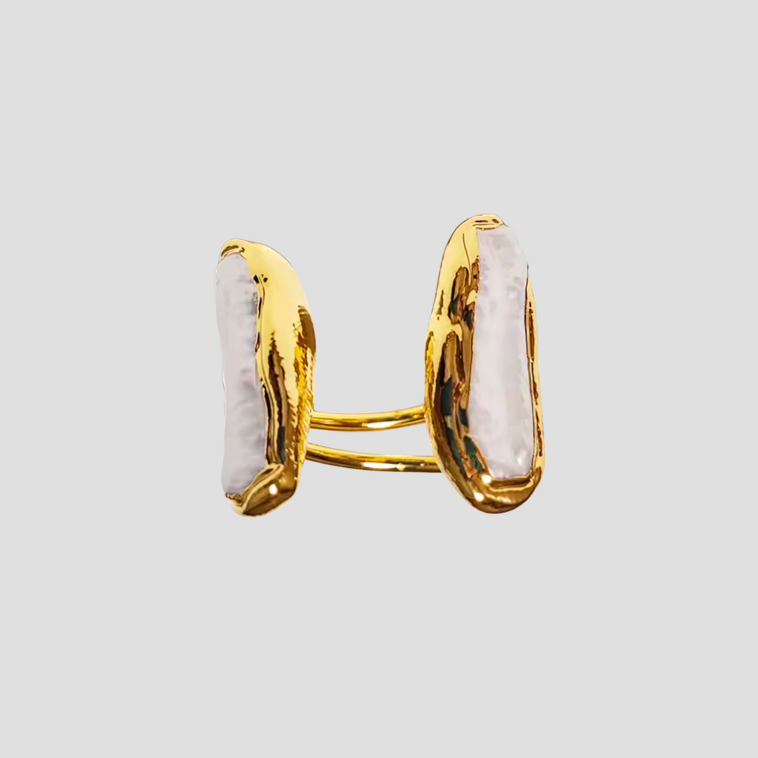 GRISÉ NYC Perlita Double Pill 18k Gold Ring featuring two organic pearl-like stones on an open gold band.