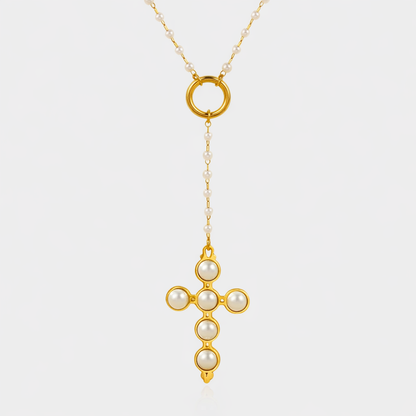 Perlita Rosary 18k gold cross pendant necklace with pearl accents and circular lariat detail by GRISÉ NYC on white background.